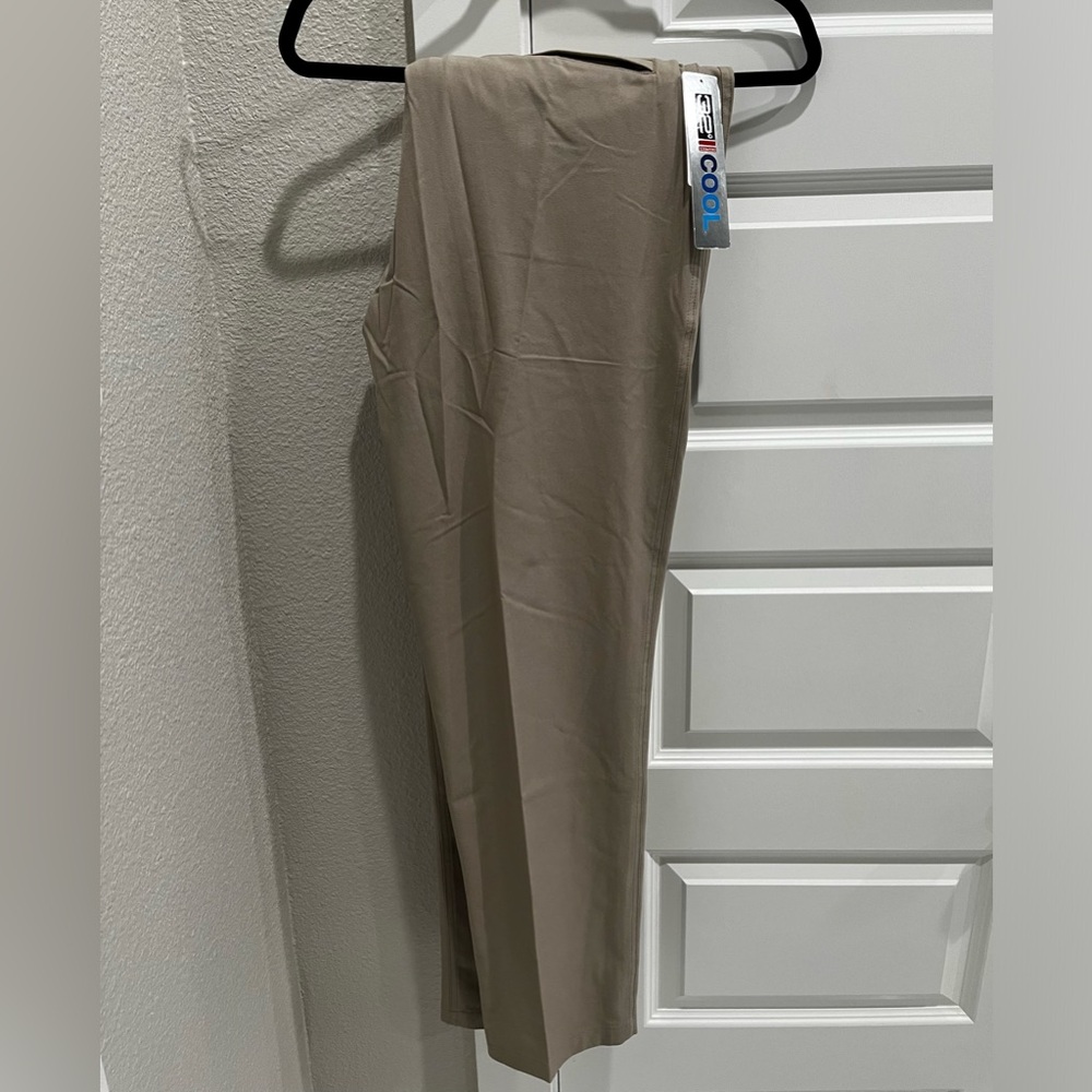 BRAND NEW -  golf pant/casual dress pant. kaki color, size 34 waist.
